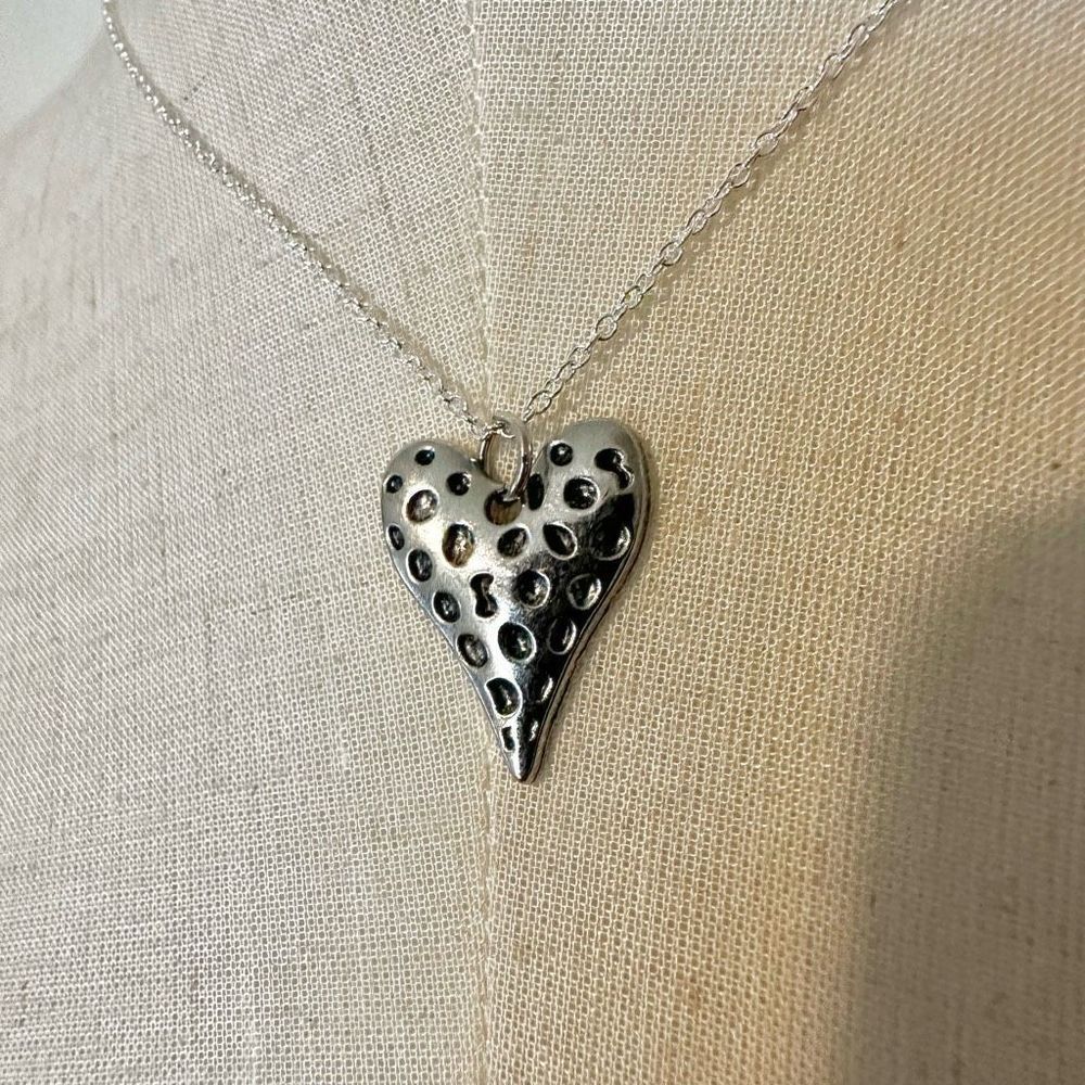 Silver tone heart pendant necklace